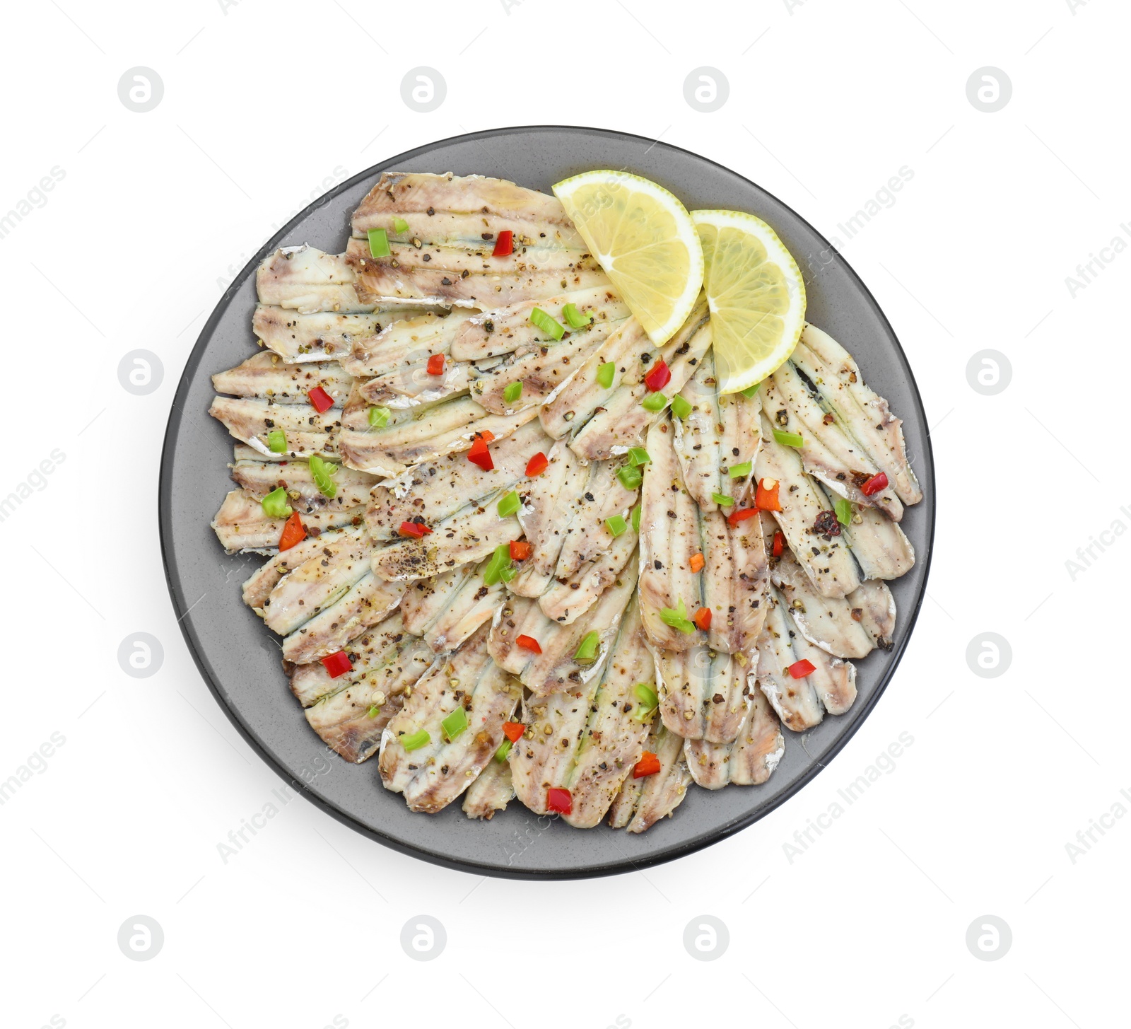 Photo of Tasty pickled anchovies with spices and lemon isolated on white, top view