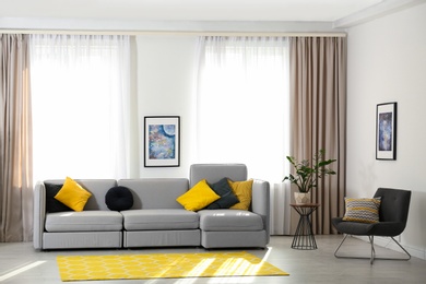 Photo of Stylish living room interior with comfortable sofa