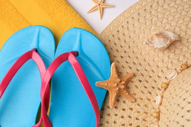 Photo of Flat lay composition with beach accessories on white background