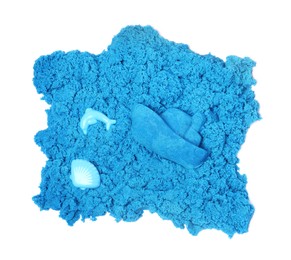 Blue kinetic sand and toys on white background, top view