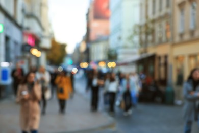 Blurred view of people walking on city street