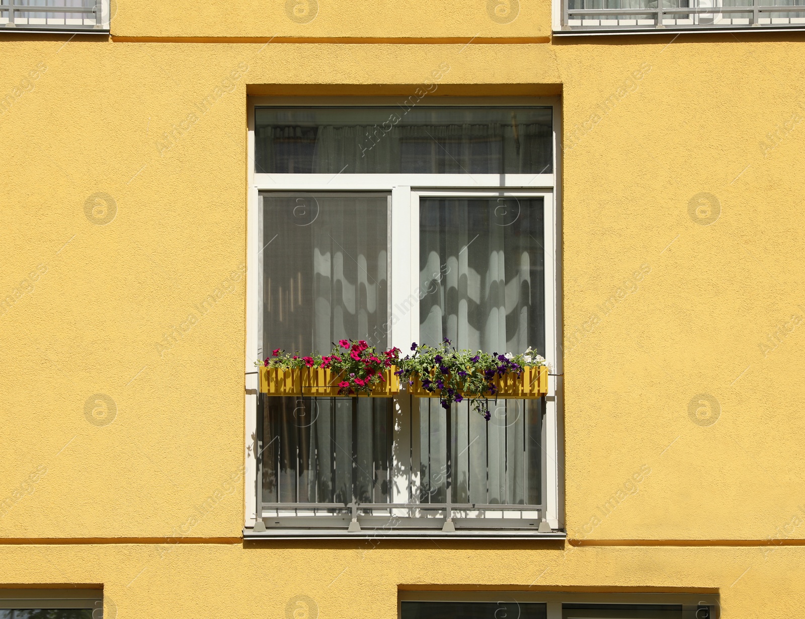 Photo of Colorful modern building with windows. Urban architecture