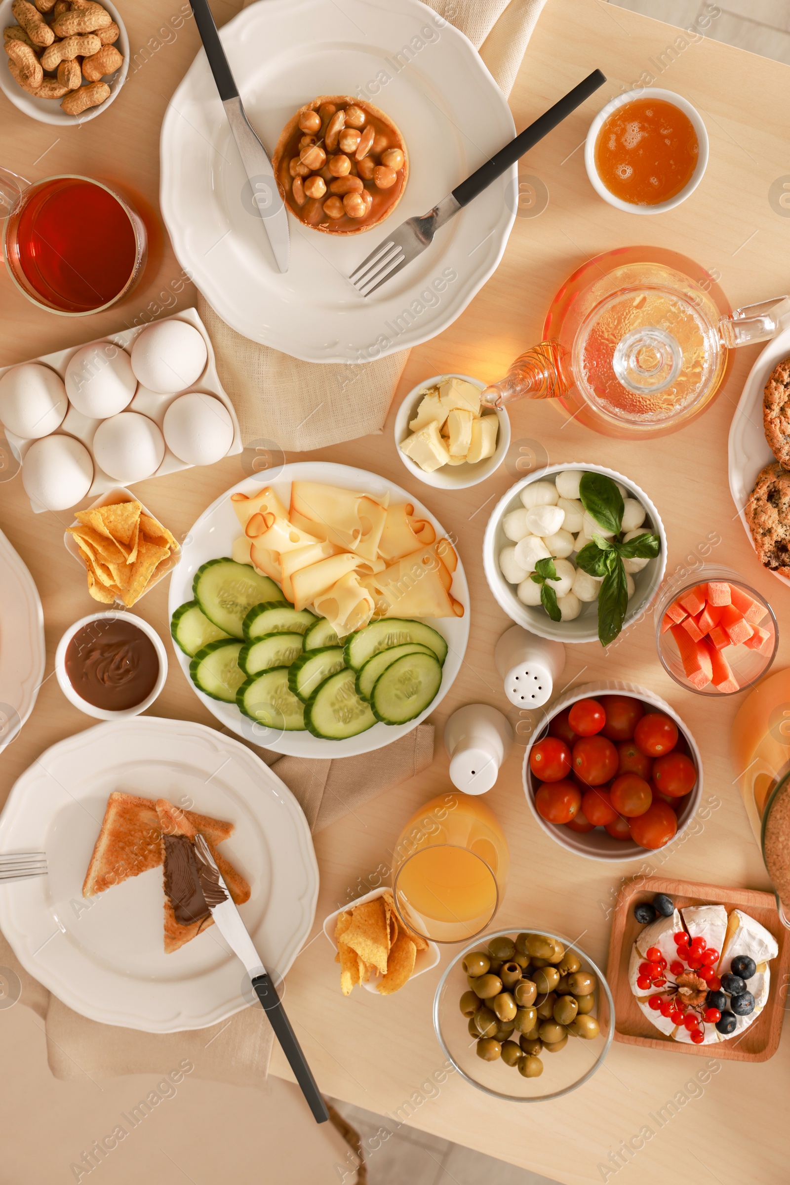 Photo of Dishes with different food on table, flat lay. Luxury brunch