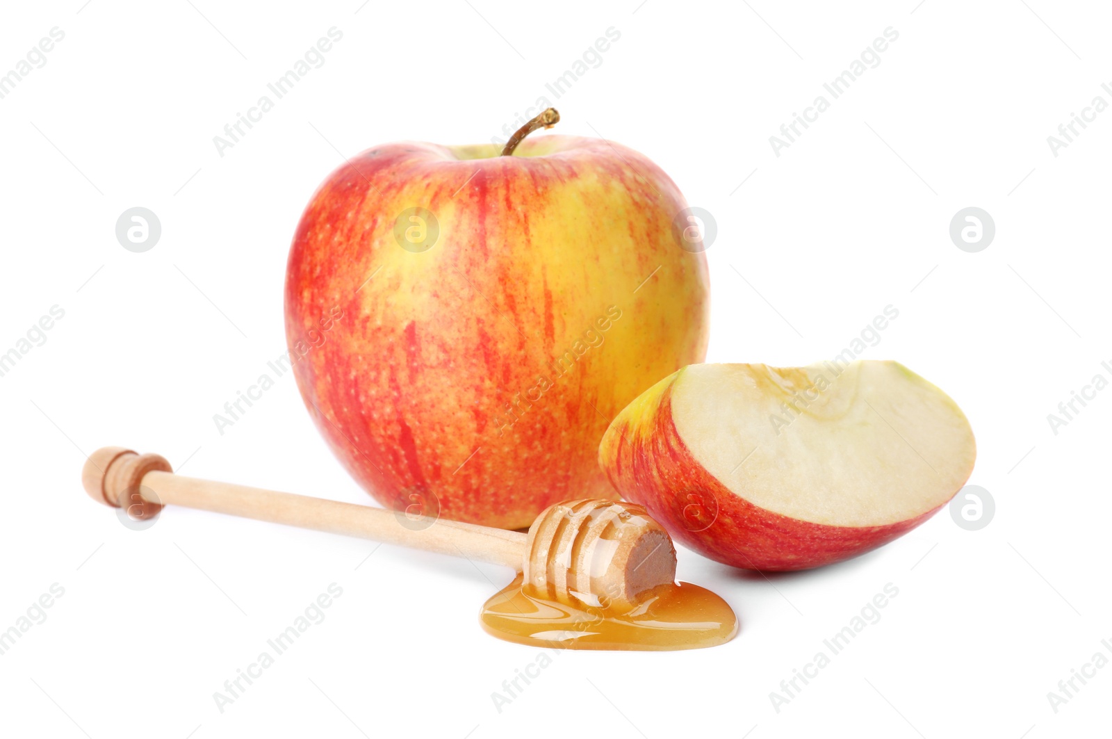 Photo of Dipper with sweet honey and apples on white background