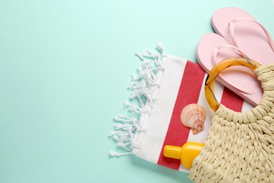 Photo of Flat lay composition with different beach objects on light blue background, space for text