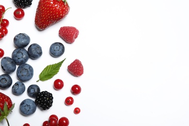 Photo of Mix of fresh berries on white background, flat lay. Space for text