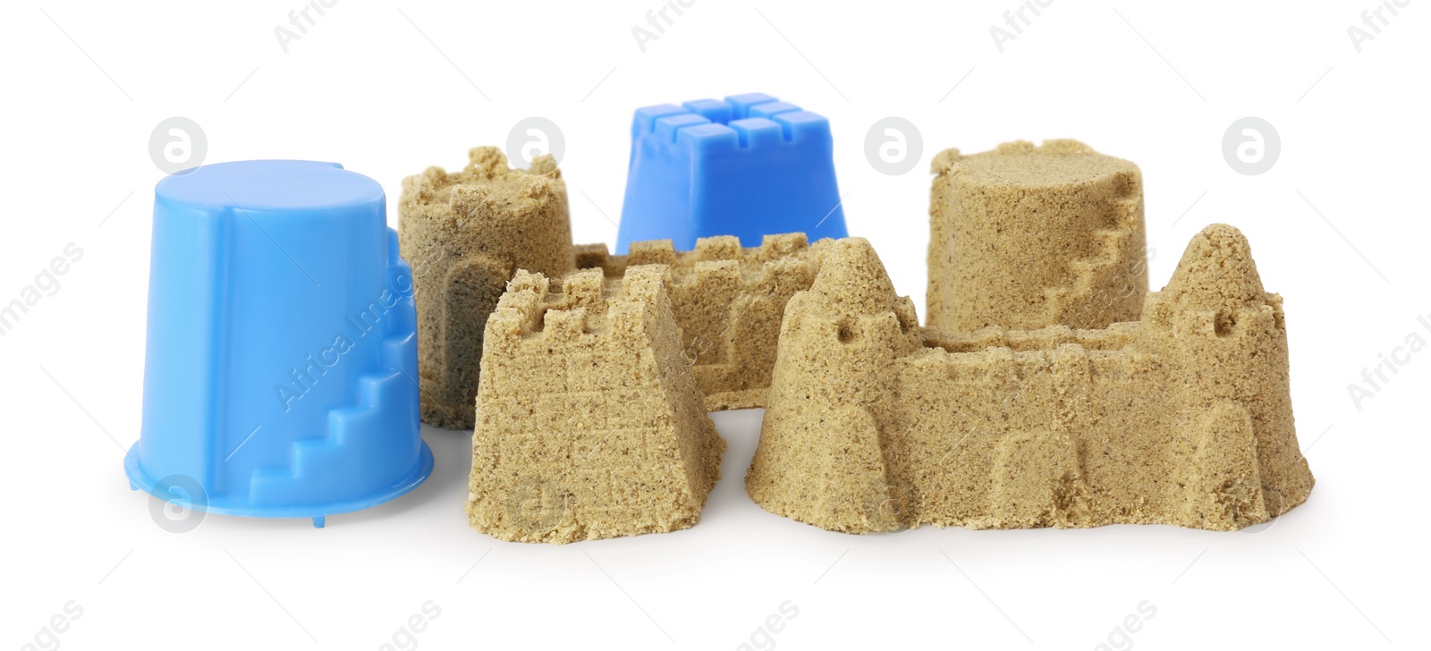 Photo of Beautiful sand castle and plastic molds isolated on white. Outdoor play