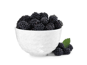 Photo of Fresh ripe blackberries in bowl isolated on white