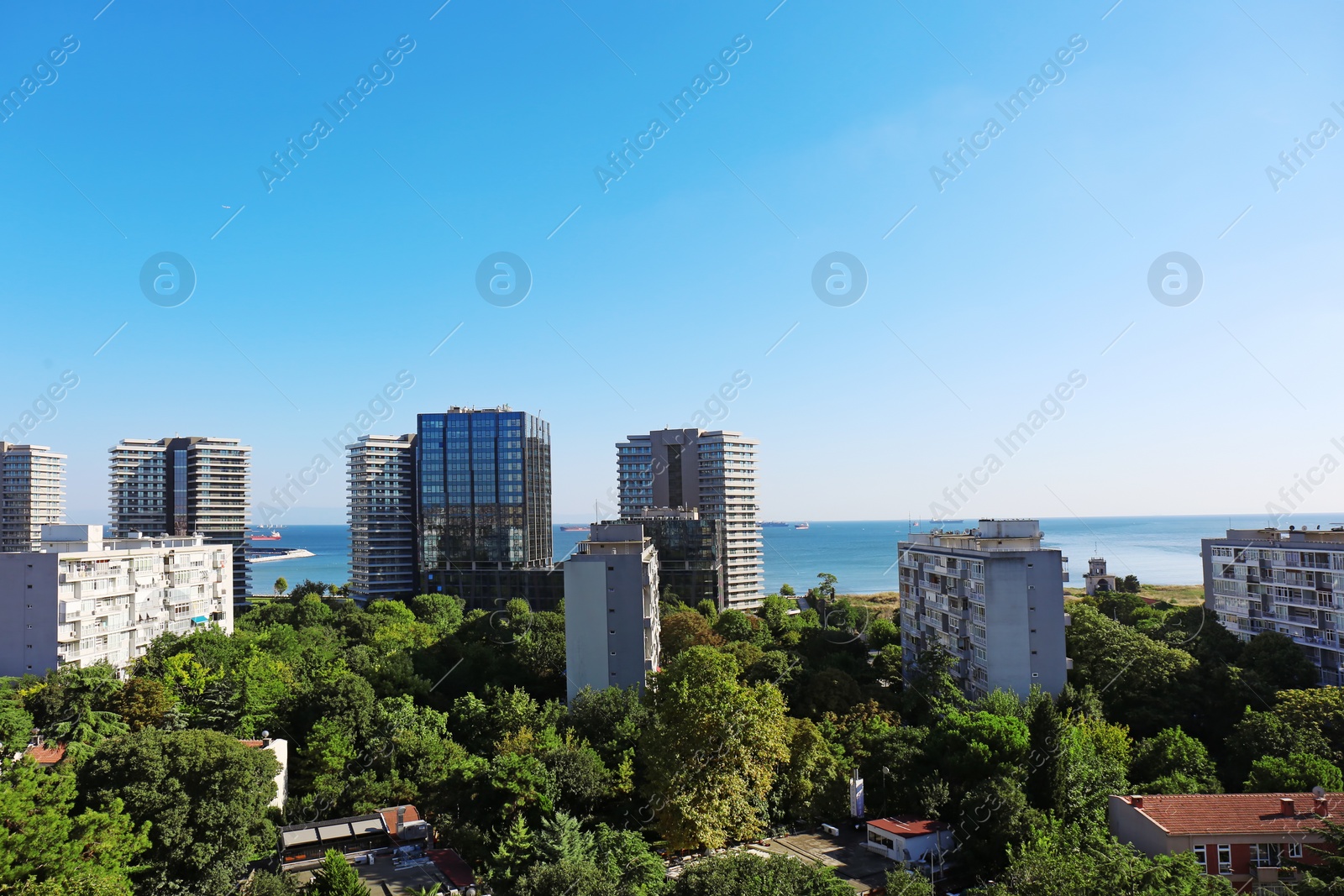 Photo of Picturesque view of city with beautiful buildings near sea