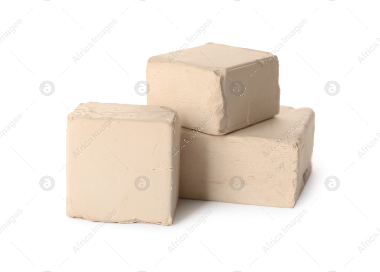 Photo of Blocks of compressed yeast on white background