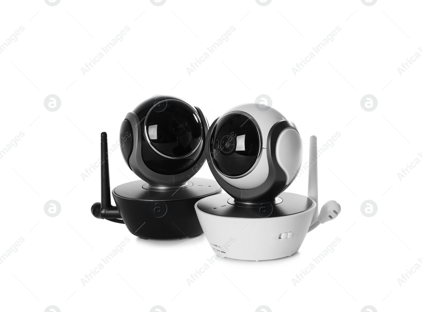 Photo of Modern CCTV security cameras on white background