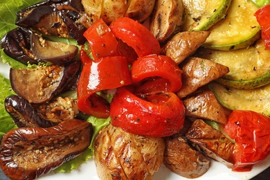 Photo of Tasty grilled vegetables on plate, closeup