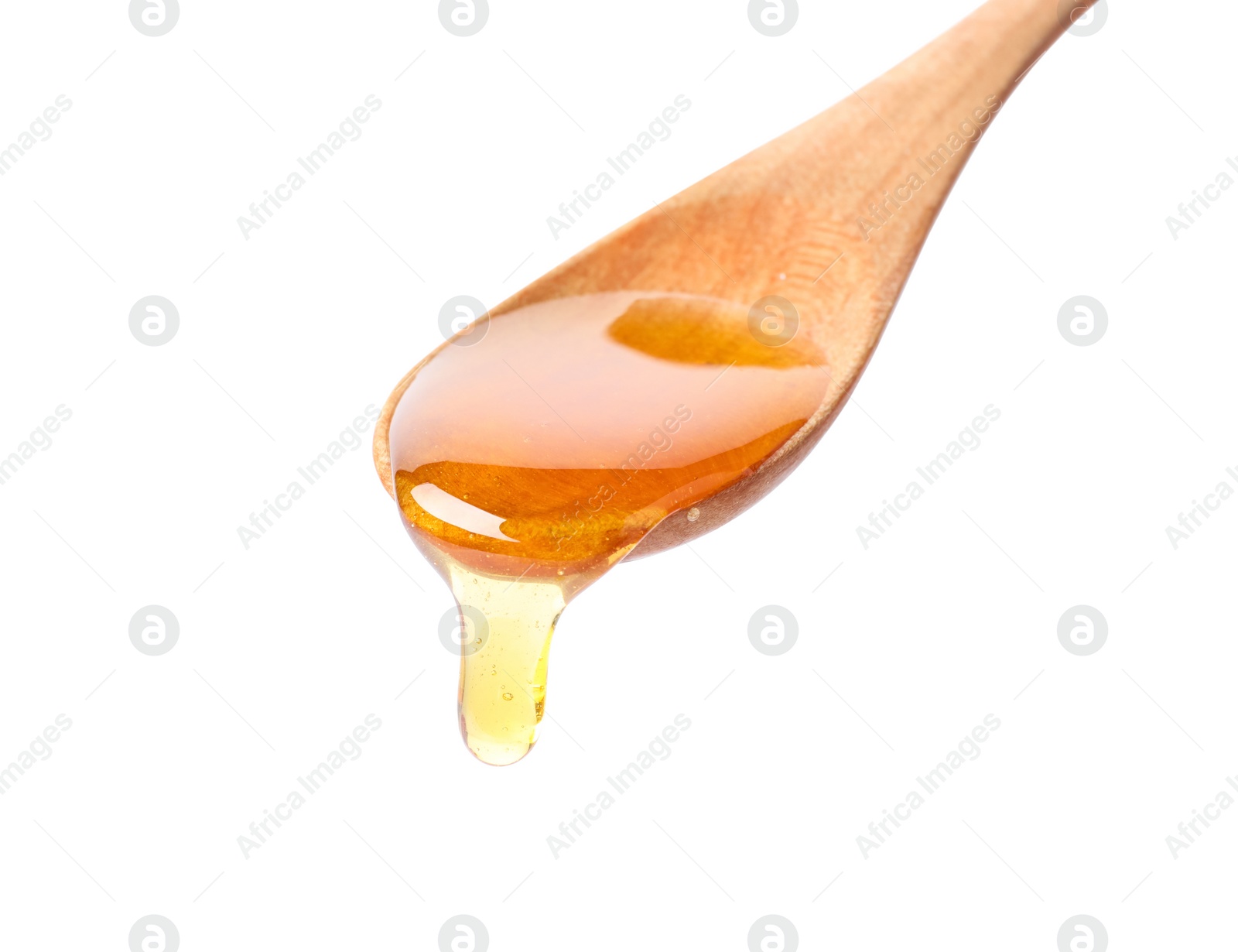 Photo of Honey dripping from spoon on white background