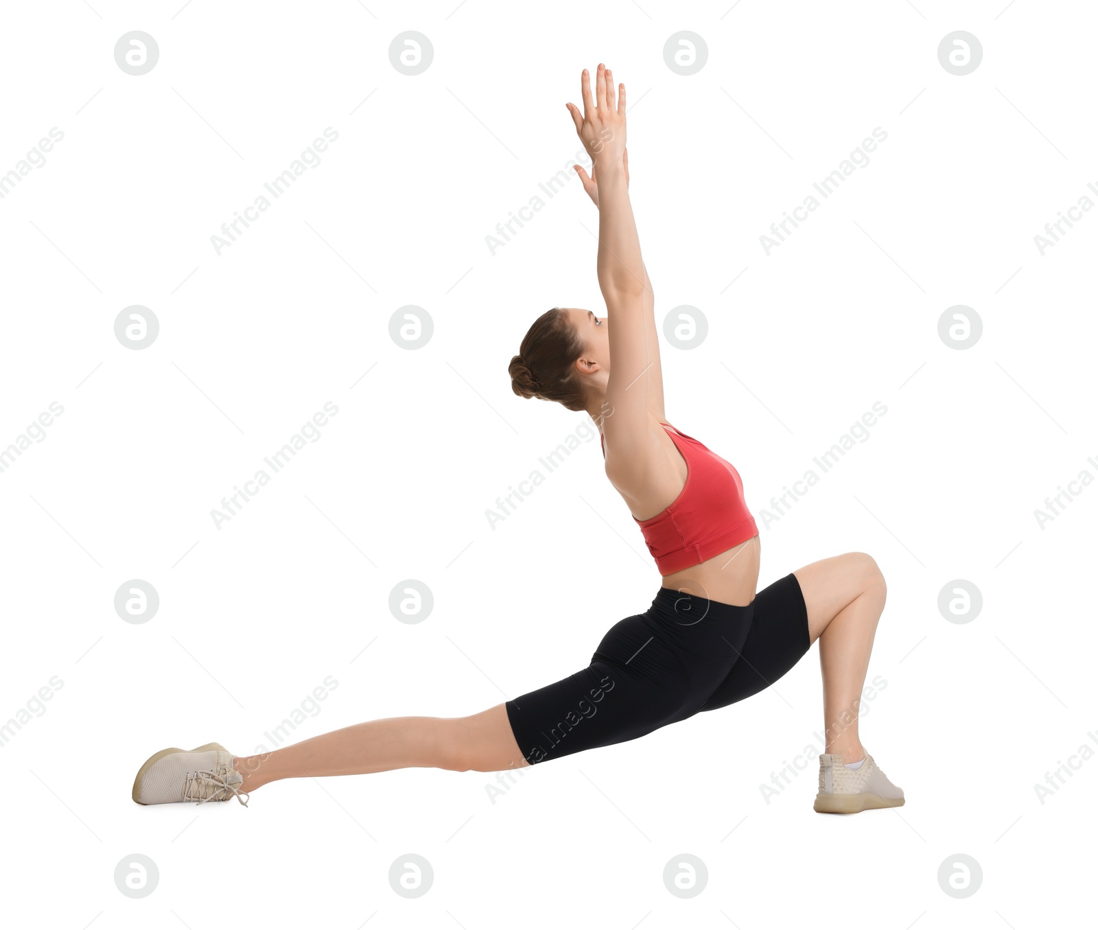 Photo of Yoga workout. Young woman stretching on white background