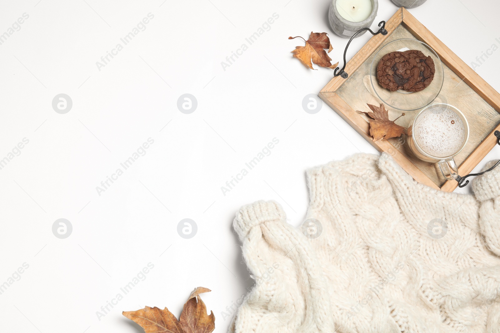 Photo of Flat lay composition with soft knitted sweater on white background