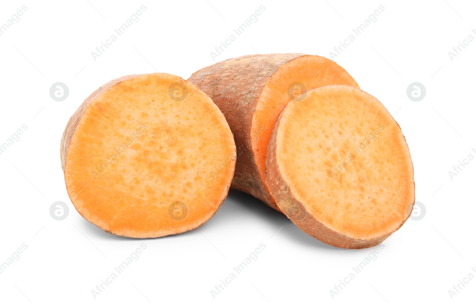 Photo of Whole and cut sweet potatoes on white background