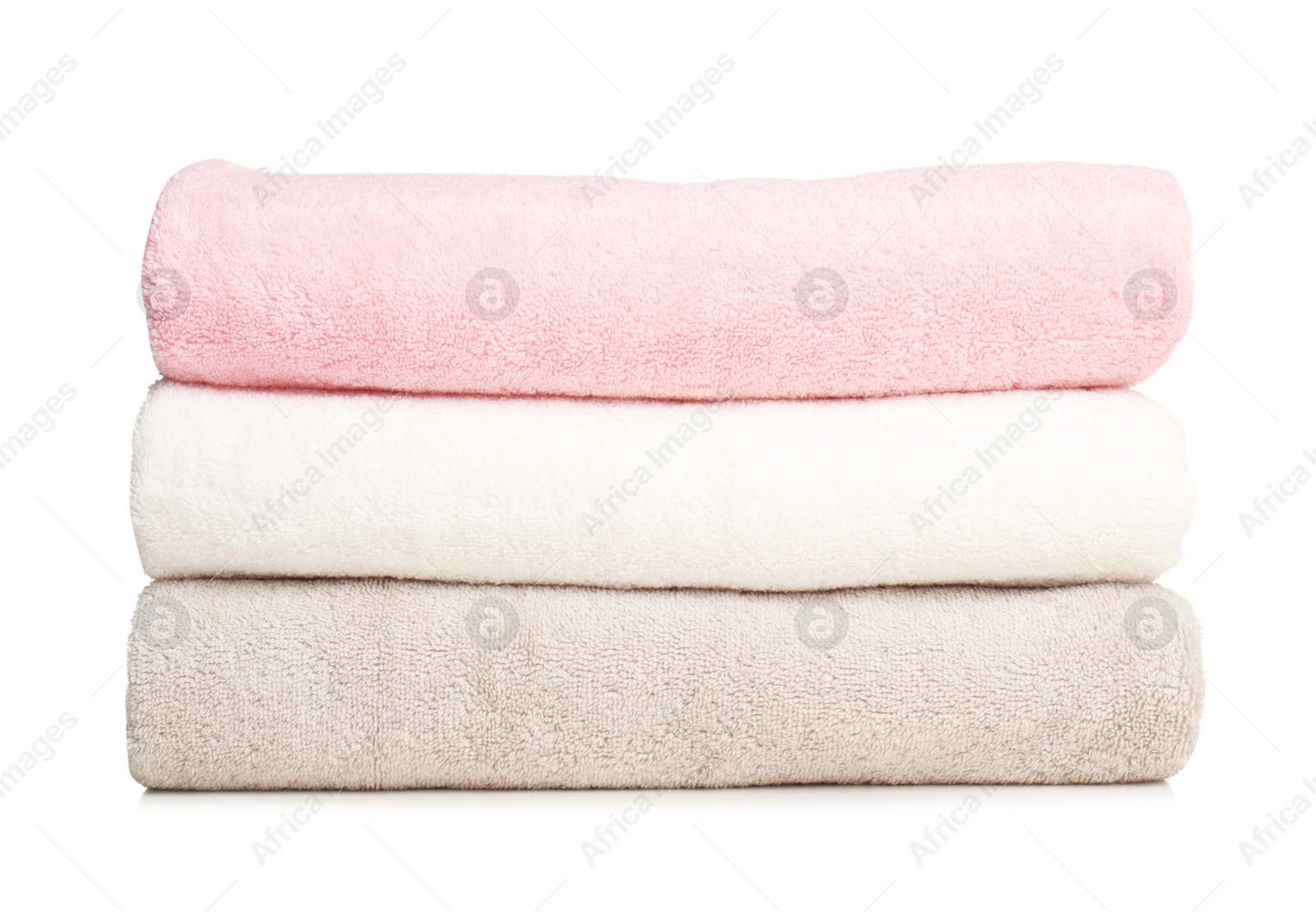 Photo of Folded soft terry towels on white background