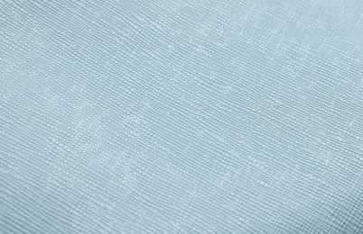 Photo of Light blue leather with seams as background, closeup