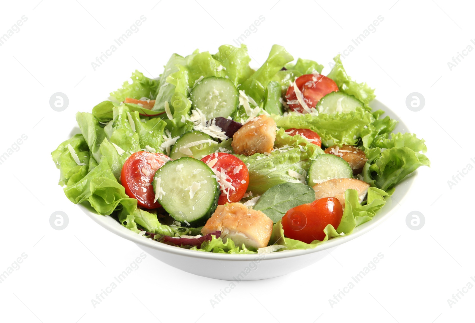 Photo of Delicious salad with chicken, cheese and vegetables in bowl isolated on white