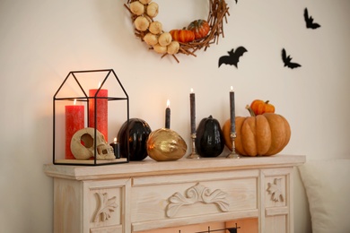 Fireplace and Halloween decor in room. Idea for festive interior