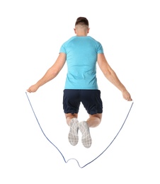 Photo of Sportive man training with jump rope on white background