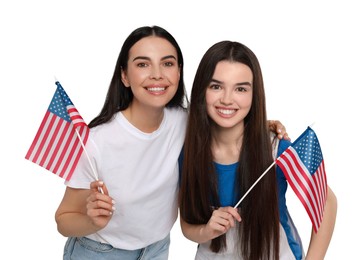 4th of July - Independence day of America. Happy mother and daughter with national flags of United States on white background