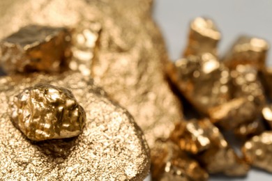 Photo of Closeup view of shiny gold nuggets, closeup. Space for text