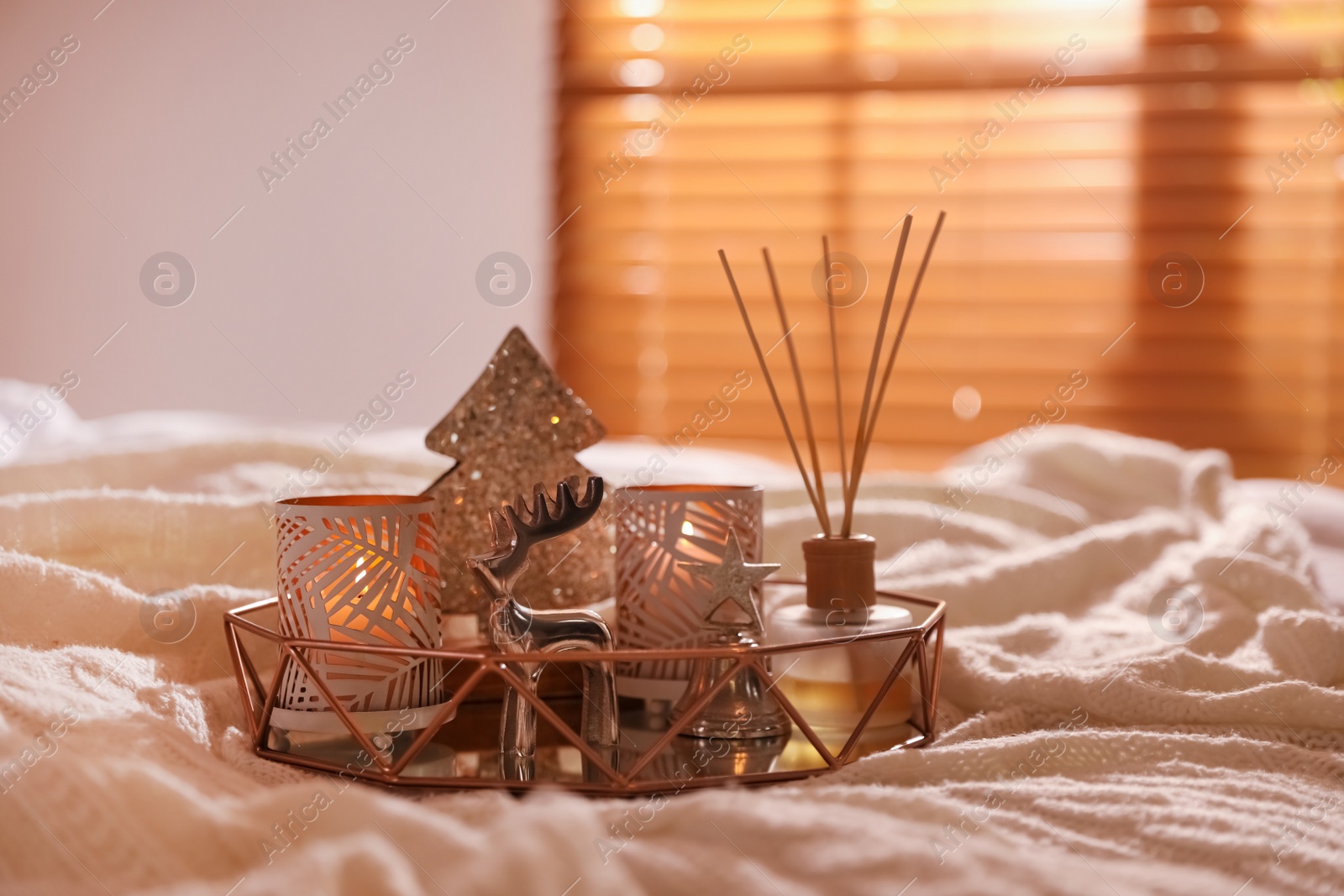 Photo of Composition with decorative Christmas tree and reindeer on blanket