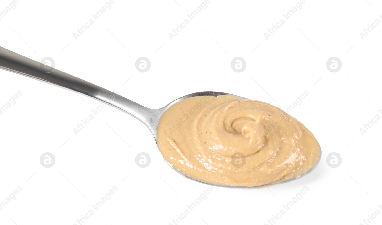 Photo of Delicious nut butter in spoon isolated on white