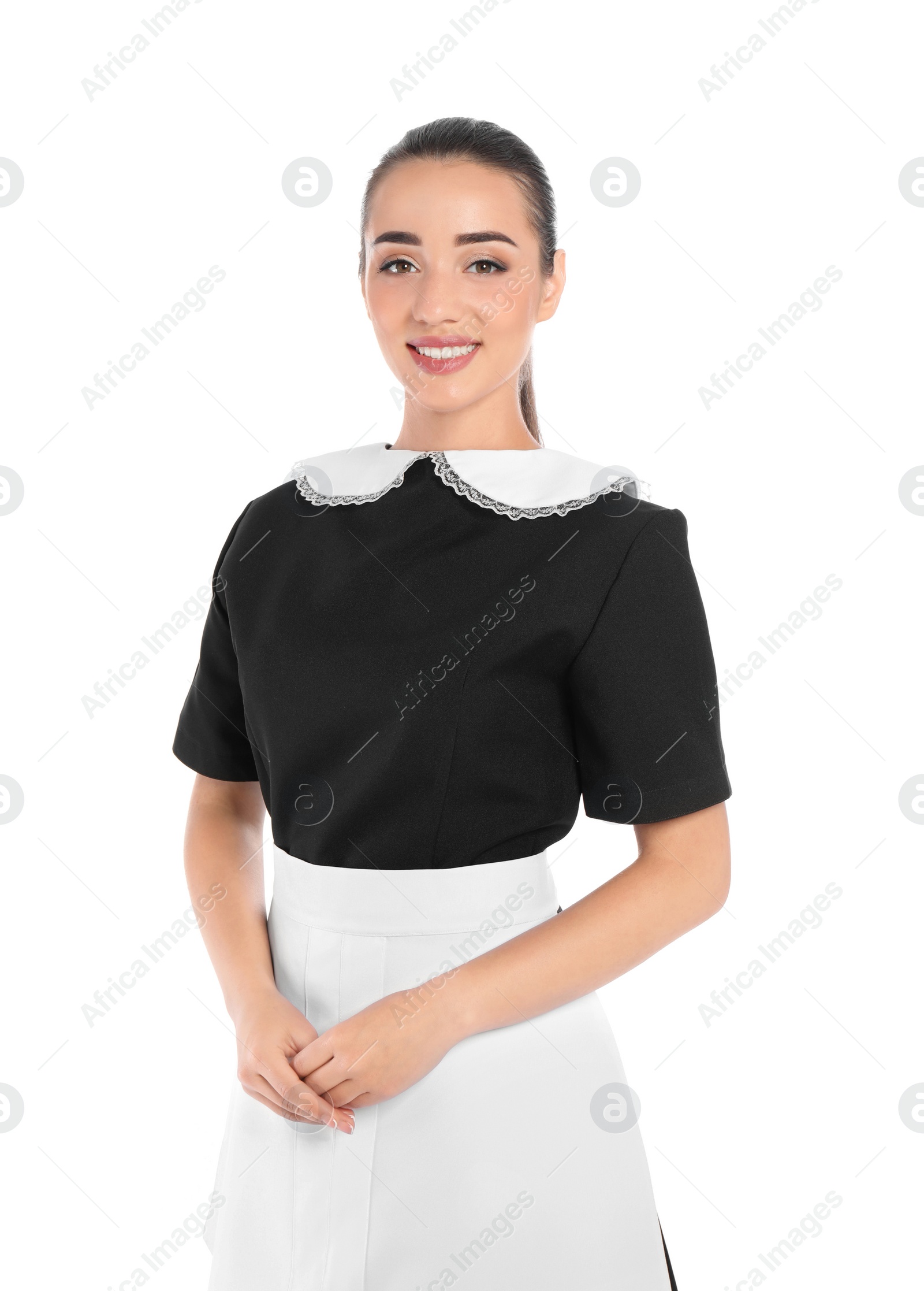 Photo of Portrait of young chambermaid in tidy uniform on white background