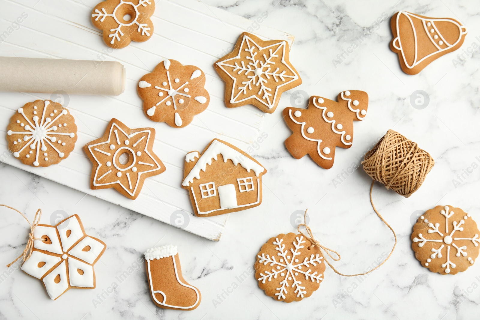 Photo of Tasty homemade Christmas cookies on marble table, top view