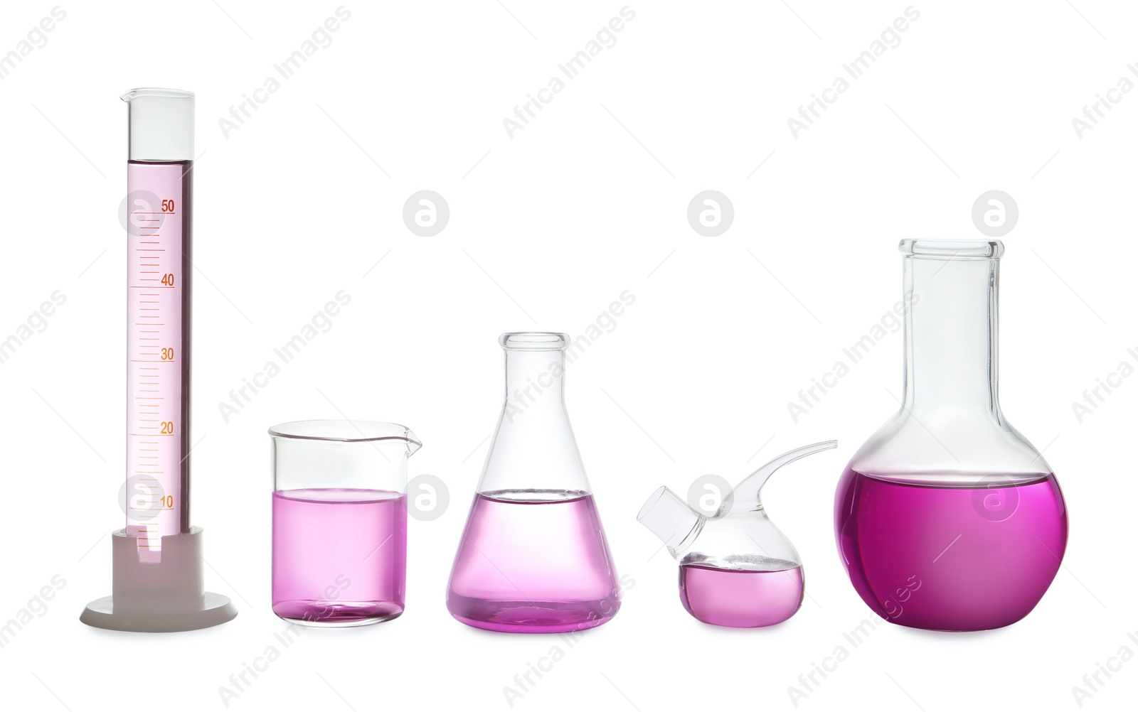 Photo of Laboratory glassware with purple liquid on white background