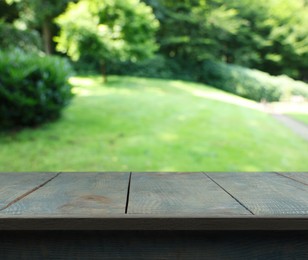 Image of Empty wooden surface outdoors on sunny day. Space for design