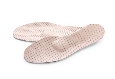 Beige comfortable orthopedic insoles isolated on white