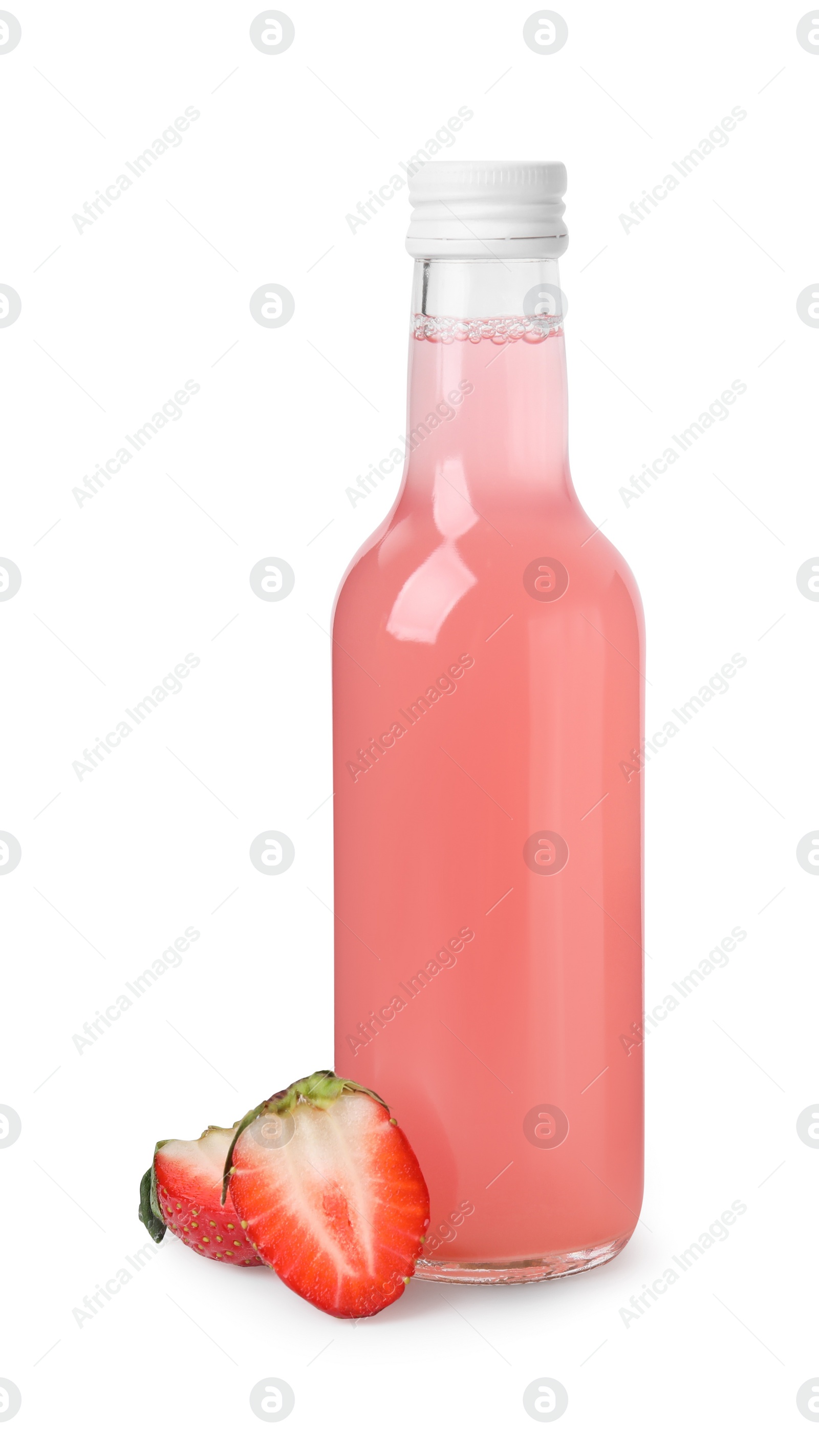 Photo of Delicious kombucha in glass bottle and halves of strawberry isolated on white