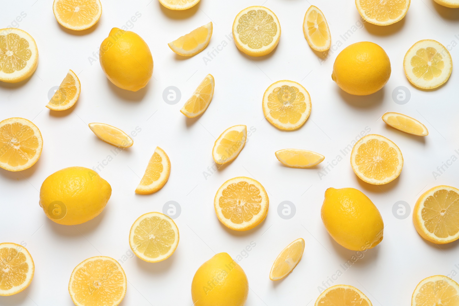 Photo of Fresh lemons on white background, top view. Citrus fruits