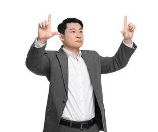 Businessman in suit posing on white background