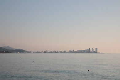 Picturesque view of sea and city under sky outdoors