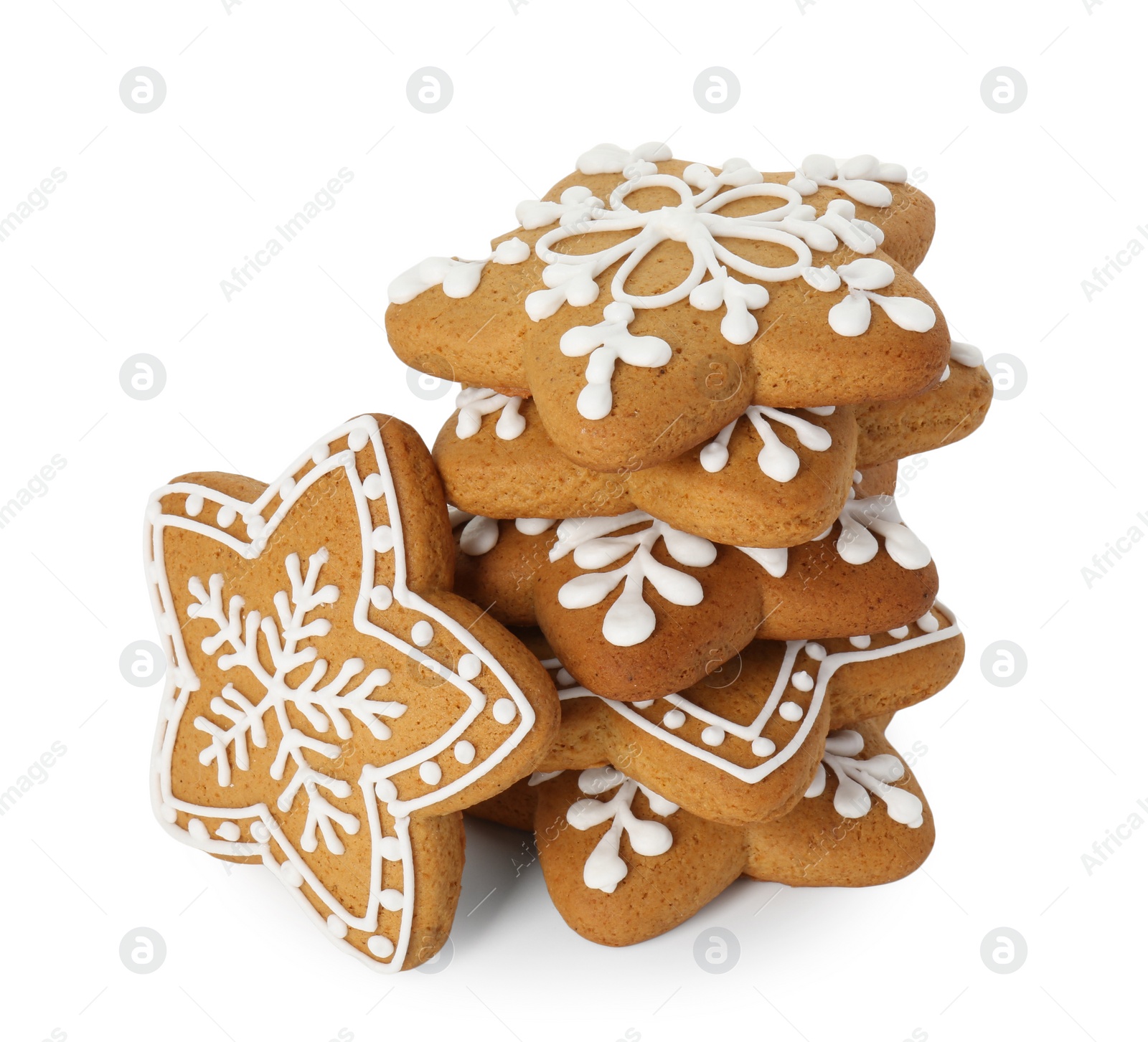 Photo of Tasty star shaped Christmas cookies with icing isolated on white