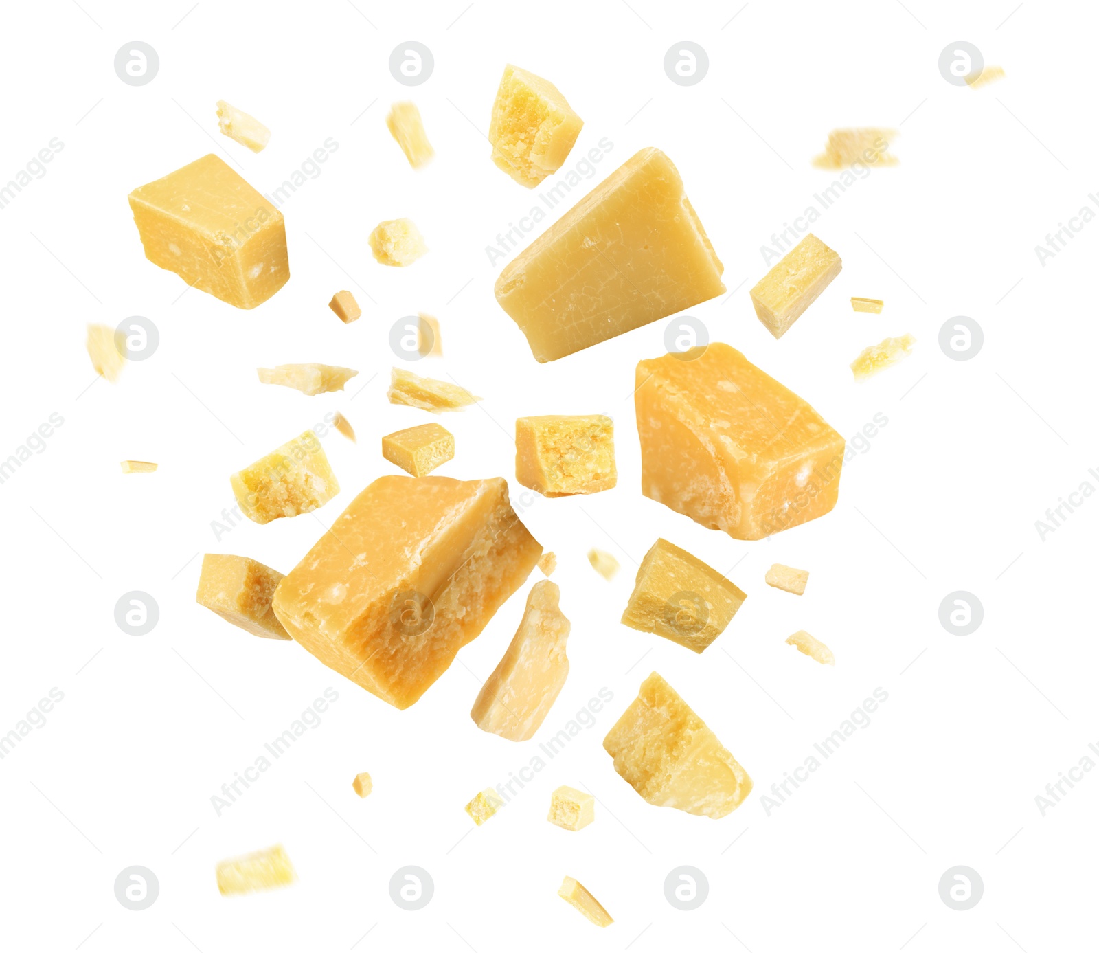 Image of Pieces of delicious parmesan cheese flying on white background