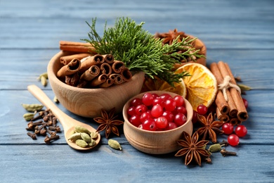 Photo of Composition with mulled wine ingredients on blue wooden table