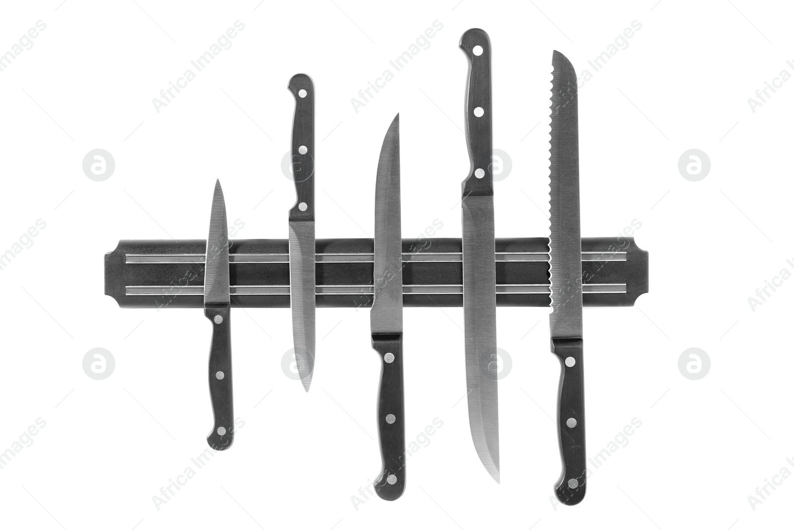 Photo of Magnetic holder with different knives isolated on white