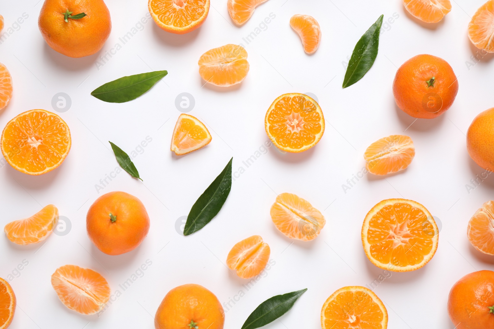 Photo of Composition with fresh ripe tangerines and leaves on white background, flat lay. Citrus fruit