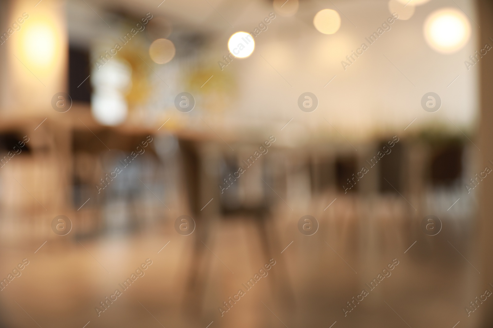 Photo of Blurred view of beautiful modern cafe interior