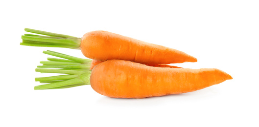 Photo of Pile of fresh ripe carrots isolated on white