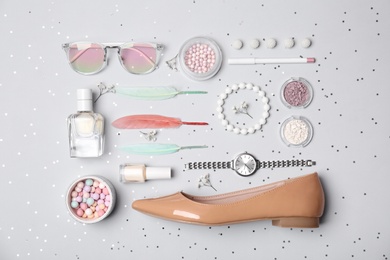 Photo of Set of accessories, cosmetics, shoe and perfume on light background, flat lay