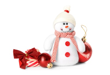 Photo of Cute snowman toy, candies and red Christmas balls isolated on white