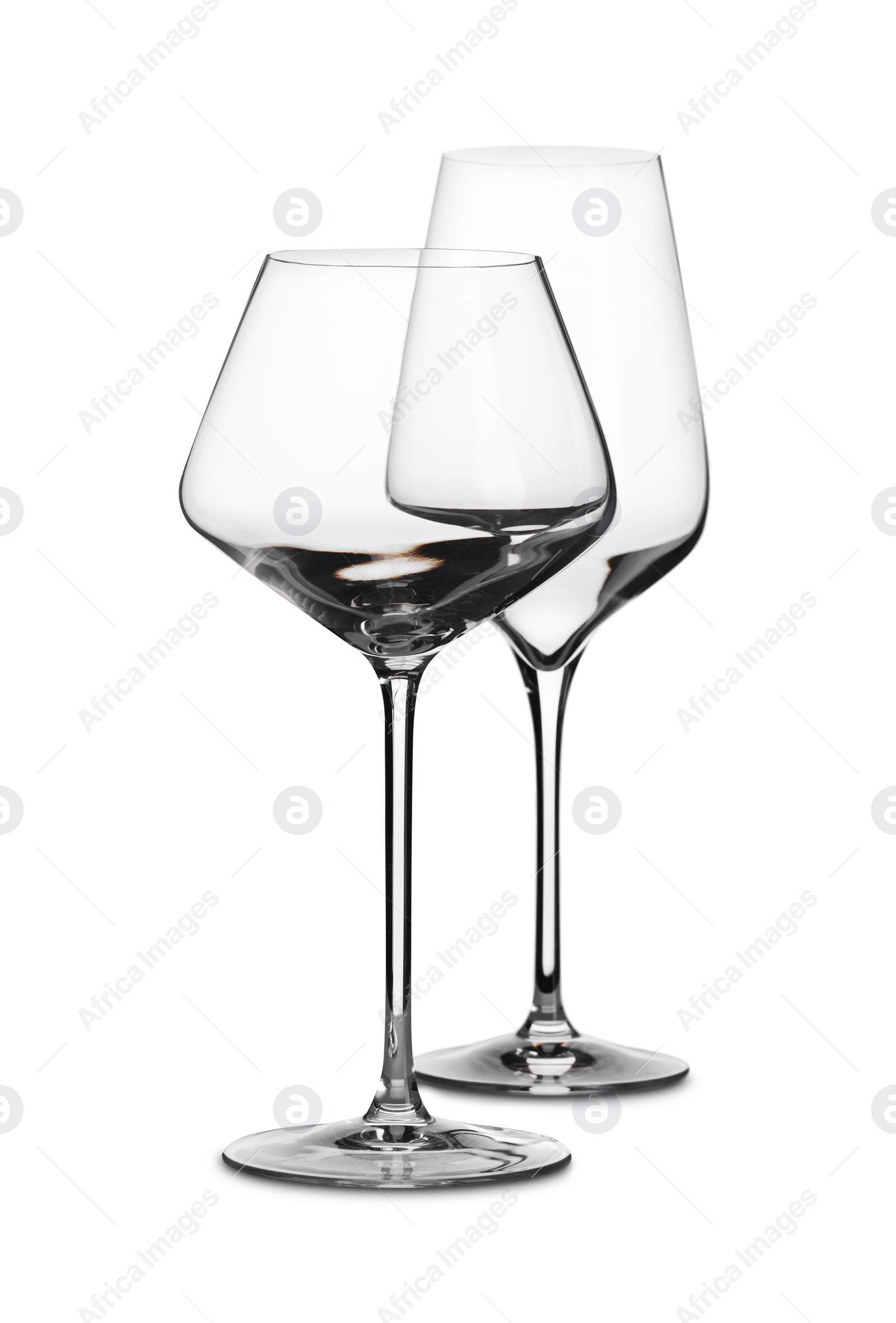 Photo of Two stylish clean glasses isolated on white