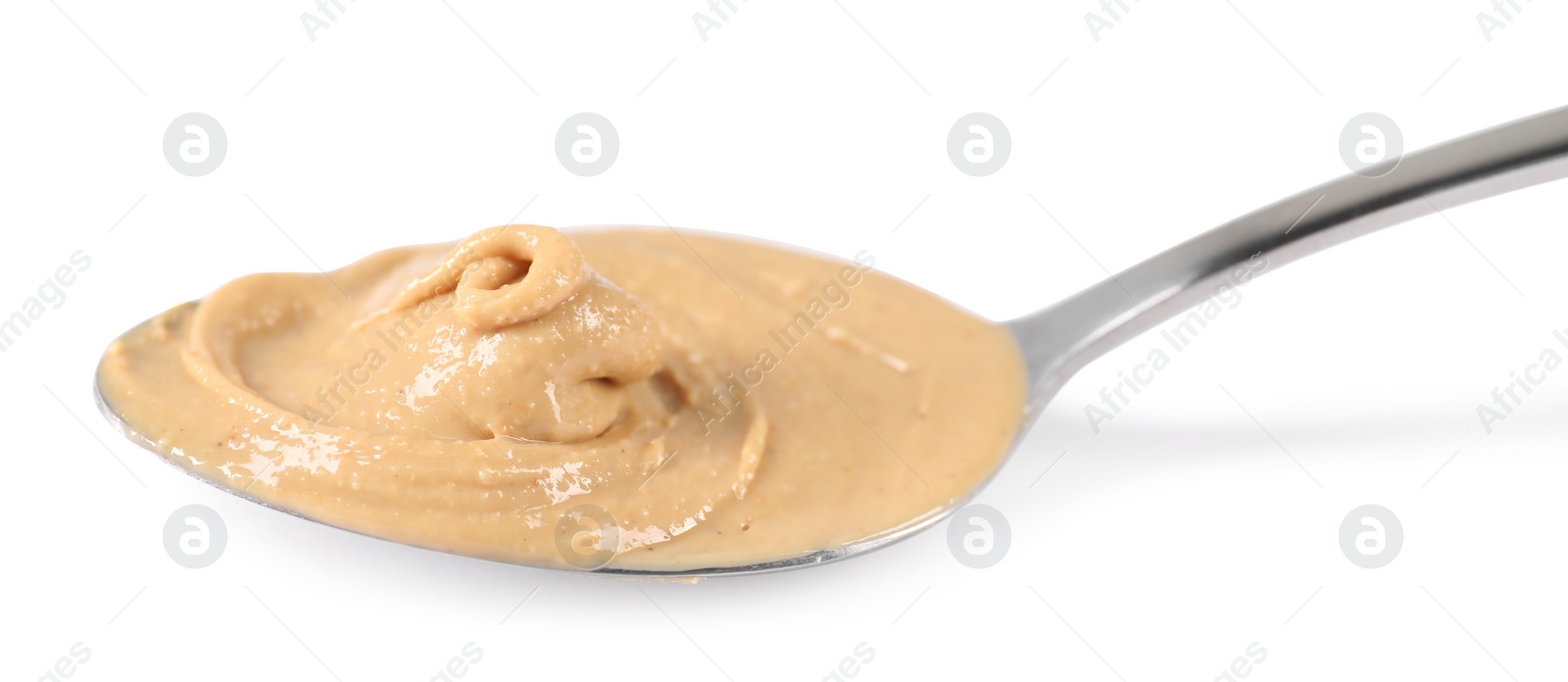 Photo of Delicious nut butter in spoon isolated on white