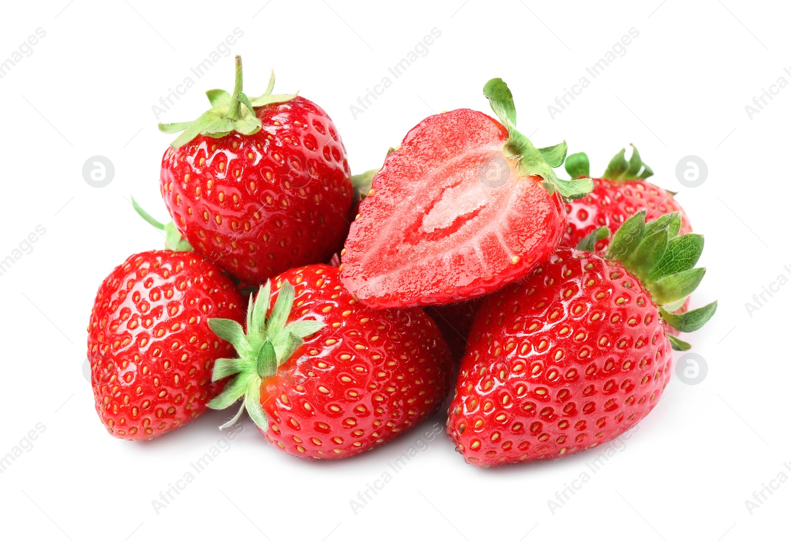 Photo of Pile of delicious cut and whole strawberries on white background